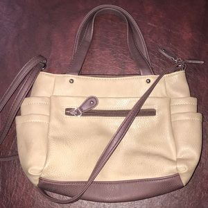 Brown and tan purse with a lot of pockets!